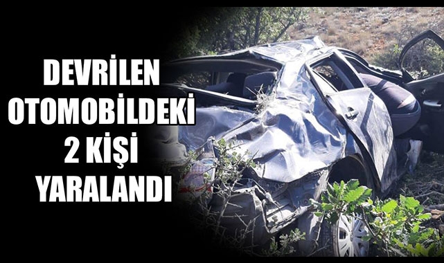 DEVRİLEN OTOMOBİLDEKİ 2 KİŞİ YARALANDI